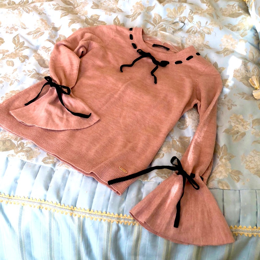 Ivanka Trump pink sweater with black velvet ribbon